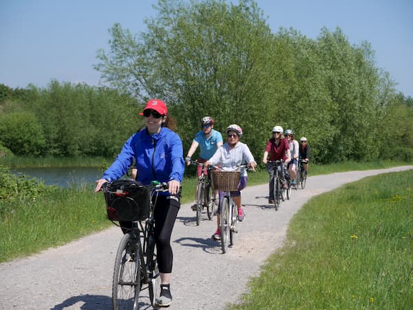 Group cycling near the Jubilee River