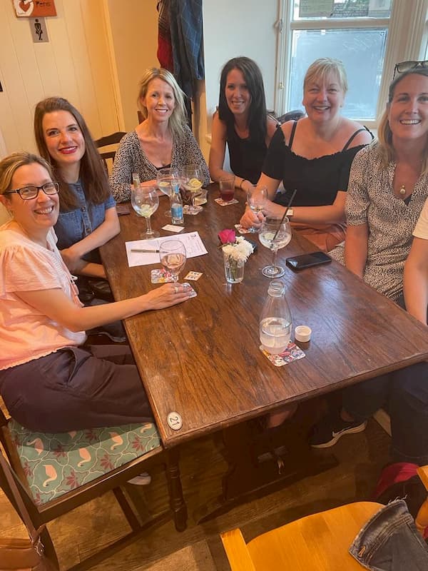 Table of Lady Quizzers looking happy