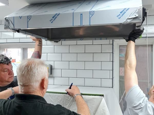 Installation of the final extraction hood into The Kitchen at The Swan.
