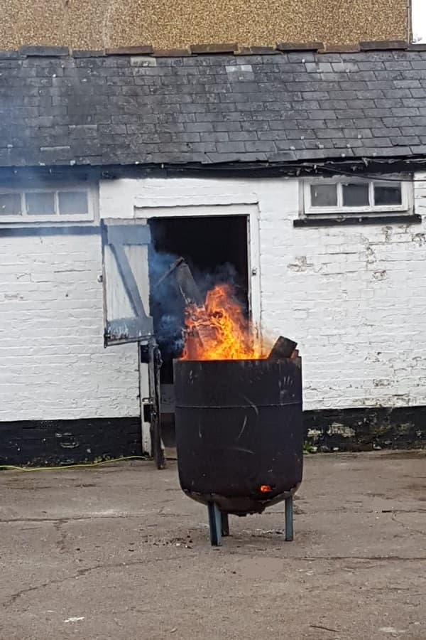 Brazier is being used to burn worst of the rotten wood