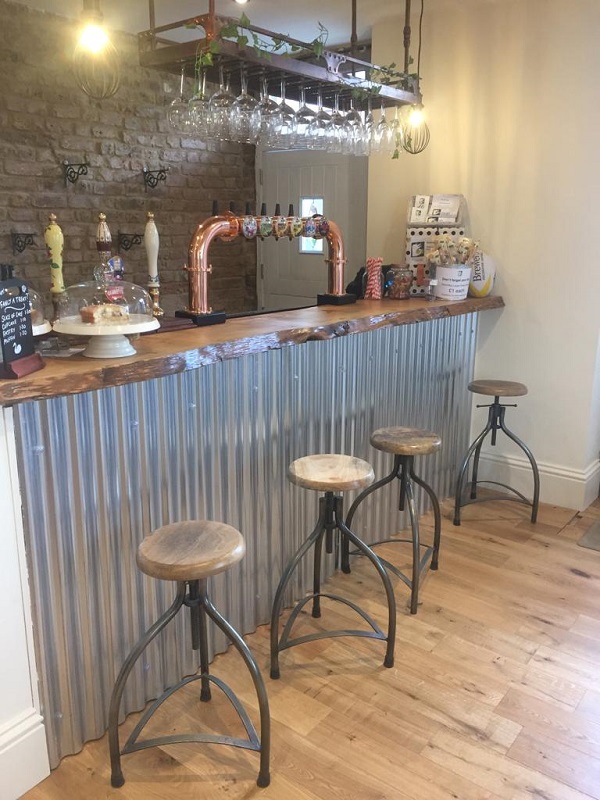 Stools in front of the new bar, also shows new lightly coloured wooden floor