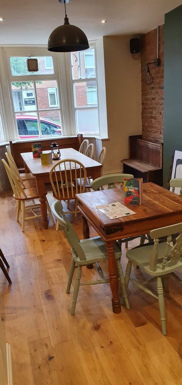 Tables and painted chairs on the new wooden floor