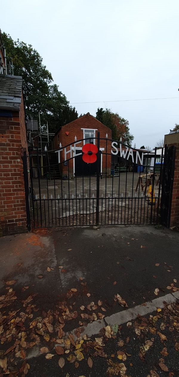 Large poppy mounted on the front gates