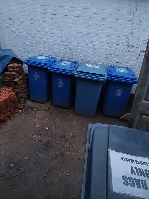 Five recycling bins all in view