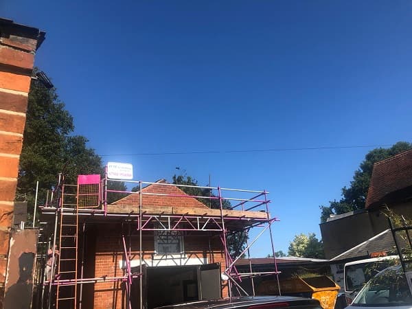 Blue sky above The Coach House, new scaffolding up