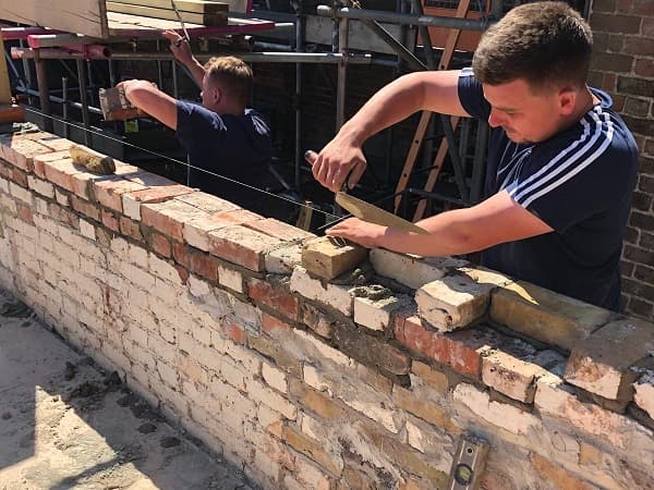 Team re-building the walls