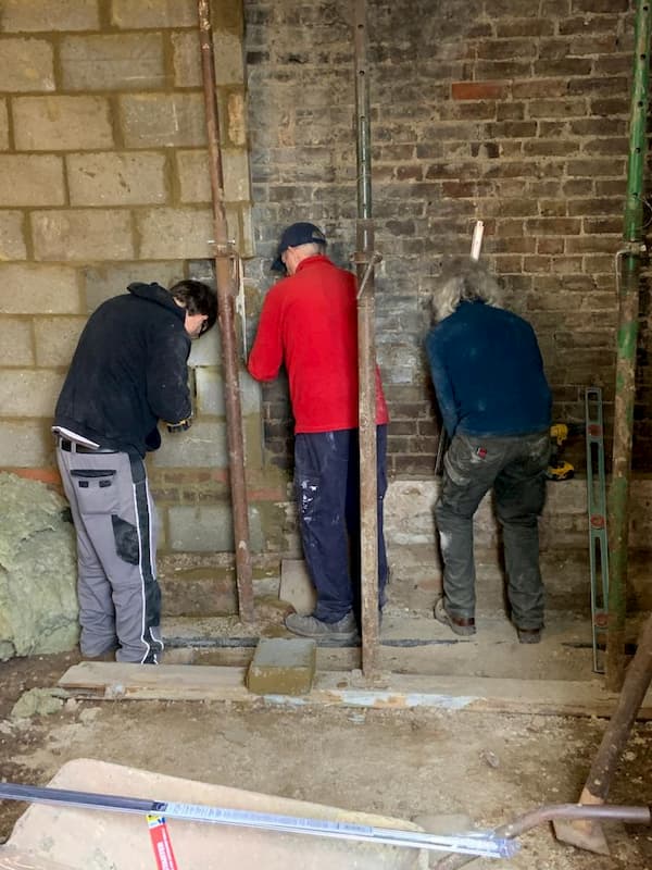 Team removing last of old back wall in The Kitchen