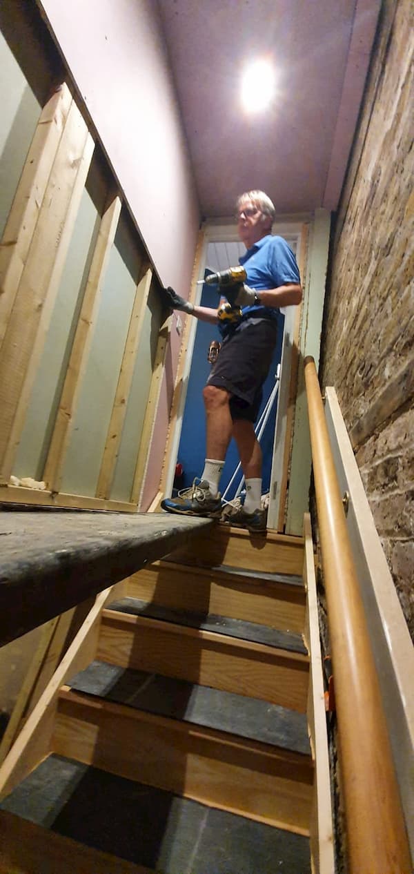 Richard fireboardng in stairwell