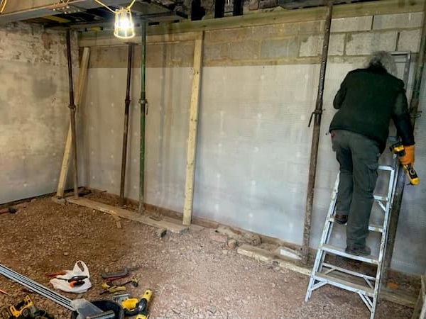 Fitting the damp proofing