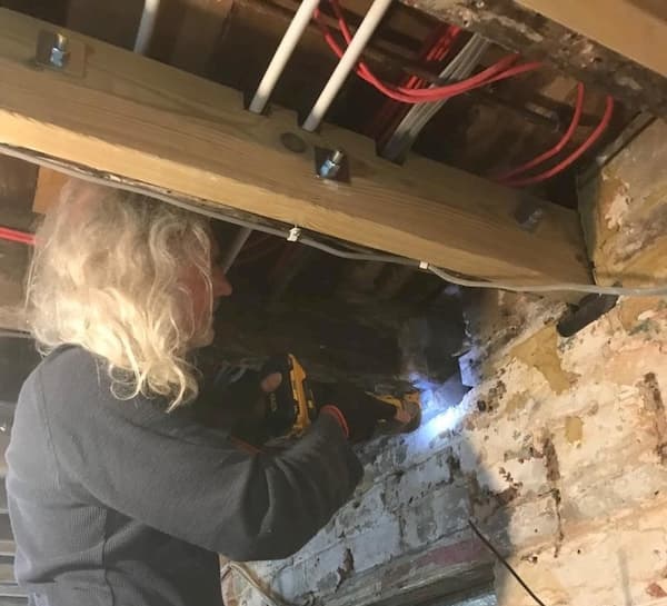 Repairing the ceiling beams in The Kitchen