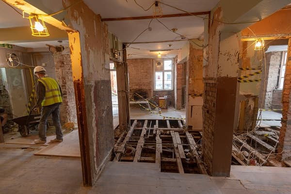 Floor boards to the right of the bar have been removed too