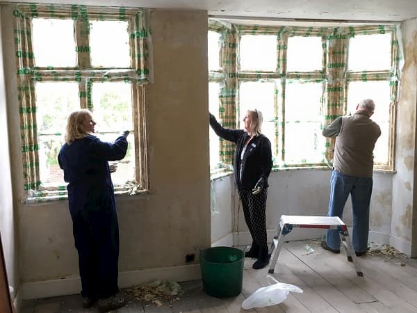 Paint stripping in the main bedroom