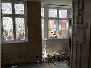 Bedroom with debris in it