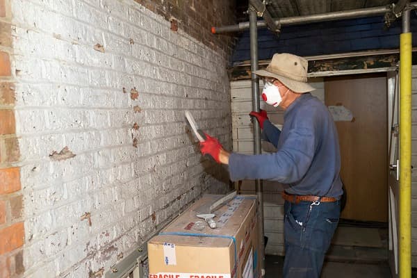 Scraping down the paintwork before painting