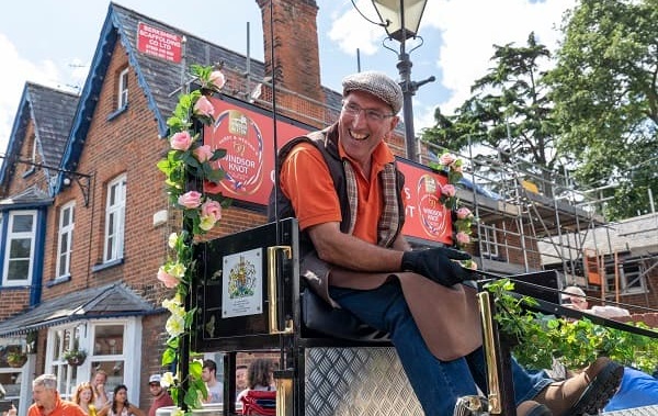 A very happy drayman in front of The Swan