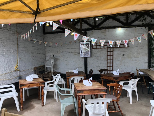 Old good looking tables, chairs, bunting ... the works