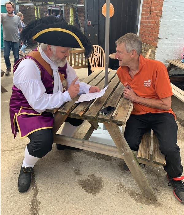Will and the Town Cryer comparing notes