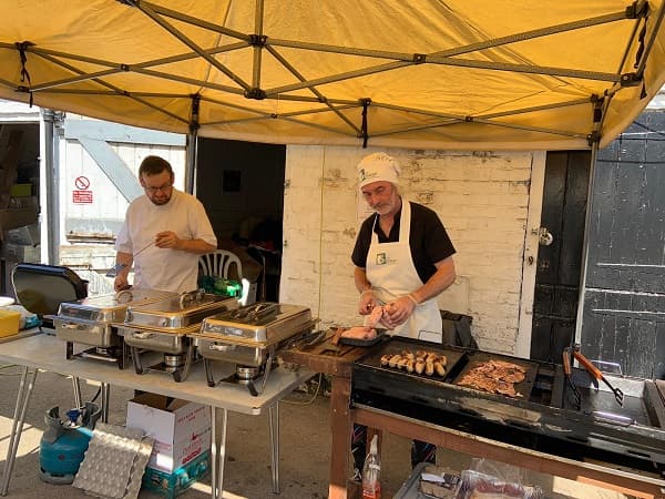 The chefs cooking away at the barbecue