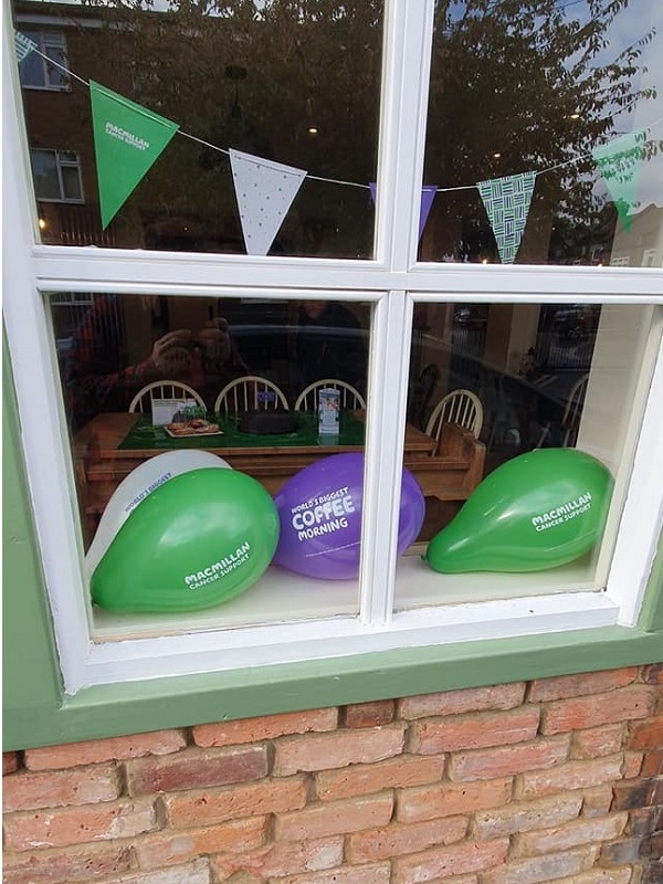 Balloons and banners in the window of the pub