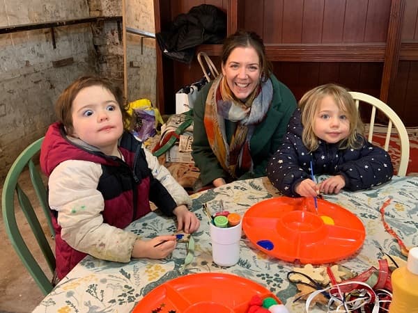 Happy family painting away