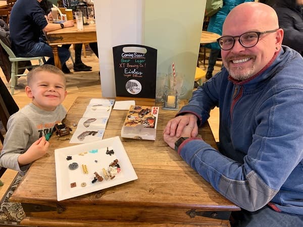 Dad and son doing some colouring in