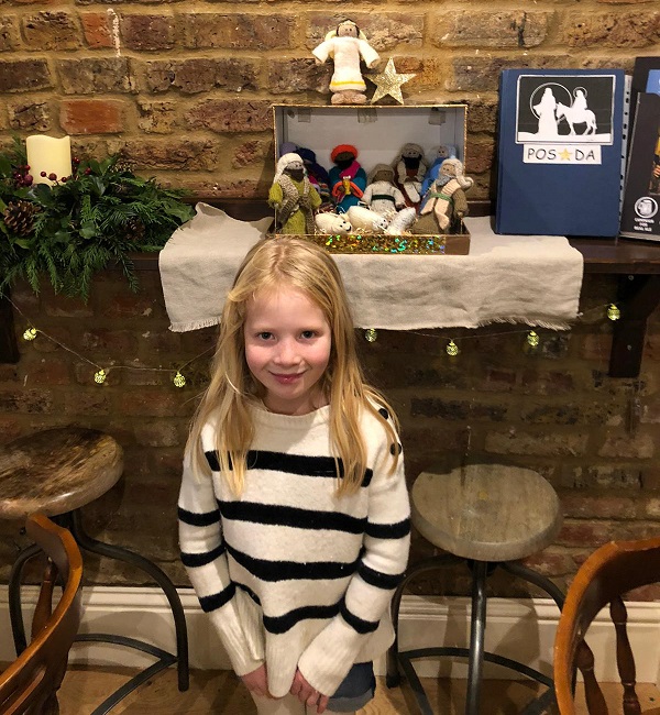 Little girl beside the Posada