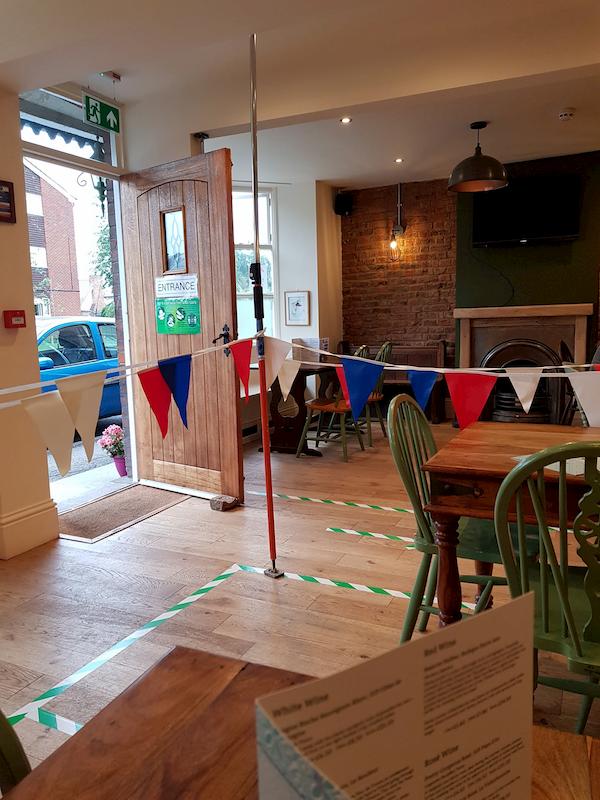 A shot inside the pub showing bunting being used to segregate areas