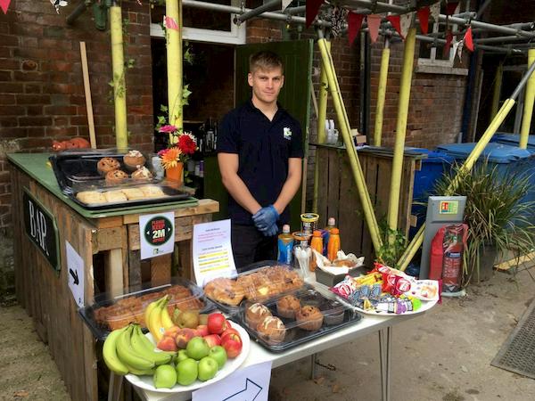 Oscar manning the health food stall