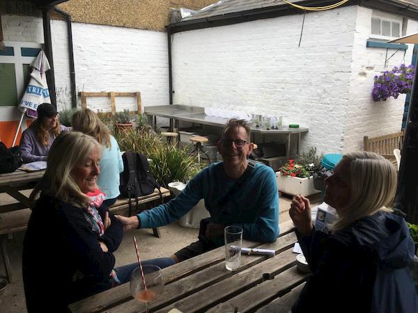 People drinking under the canopy