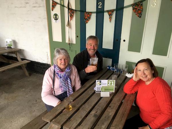 FOlk enjoying themselves at one of th benchseats