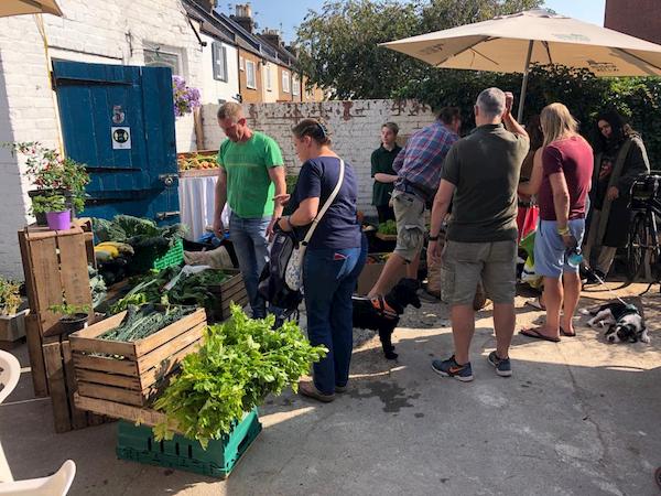 The produce stall is busy