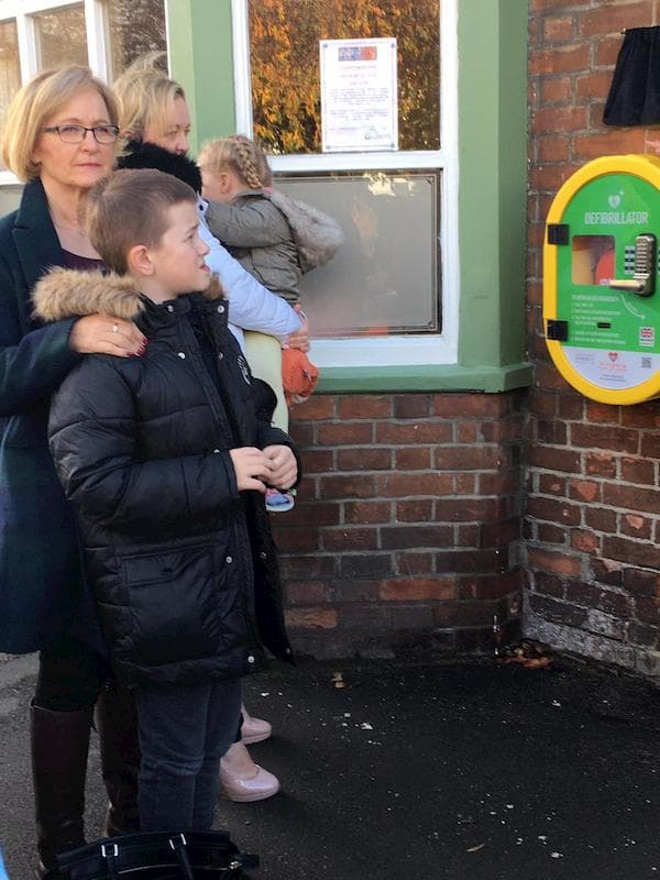 Dawn and her grandson at the defib