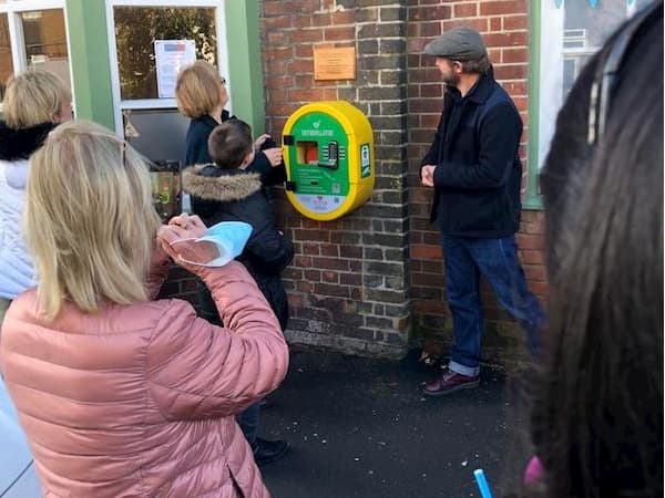 Dawn reading the words on the plaque just after the unveiling