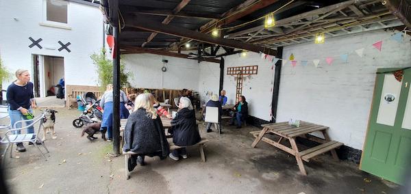 Underneath the awning in The Courtyard (affectionately called the cow shed)