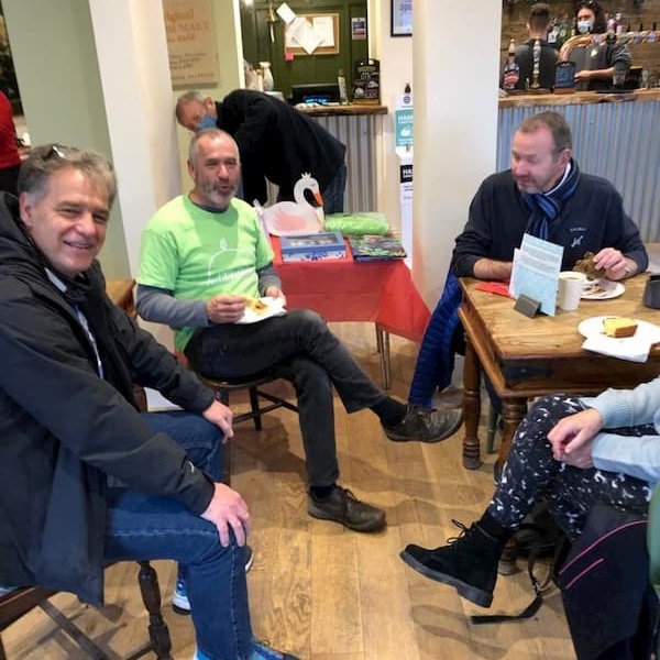 People enjoying coffee and cake