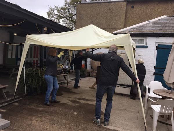 Putting up the gazebo - the team eventually won