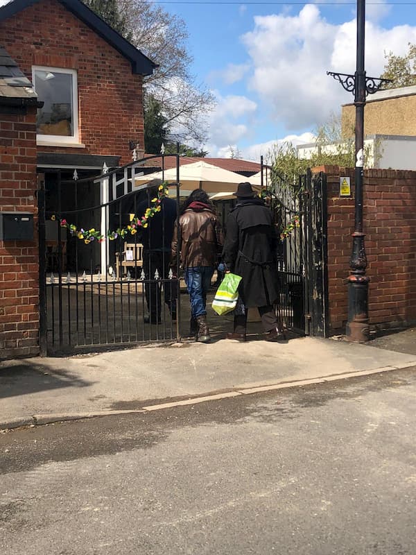 People entering through the main gates