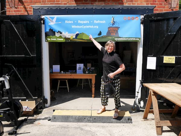 Reverend Rosie pointing out the WCH sign