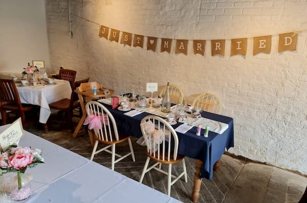 Inside The Coach House with a Just Married banner on the wall