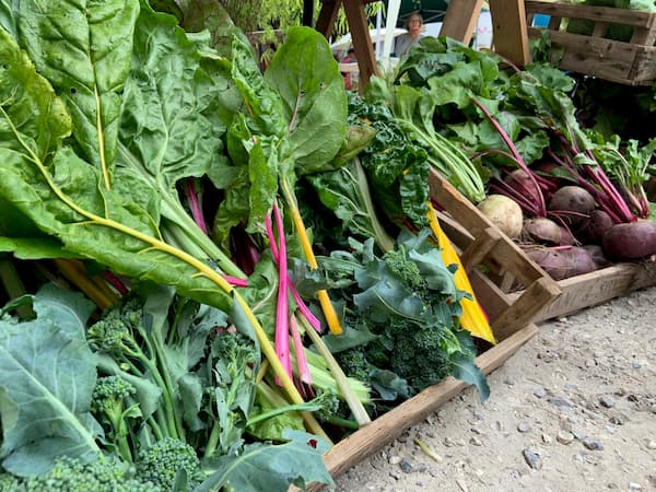 Green produce at the front of the stall