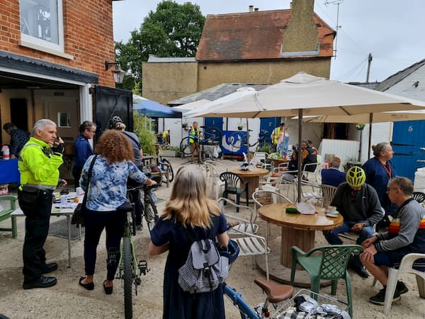 A busy Courtyard with cyclists, WCH volunteers and TVP