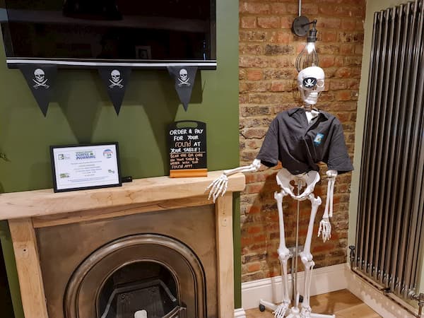 Skeleton at the fireplace