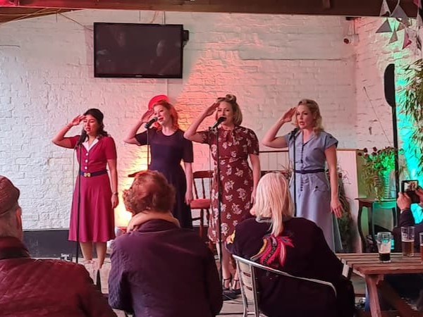 Albert Street Gals doing a salute