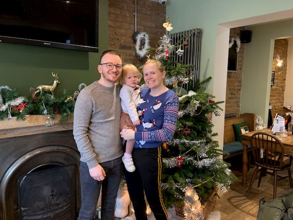 Happy family in the bar after seeing Santa