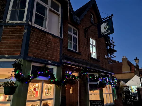 The front of The Pub in the dark