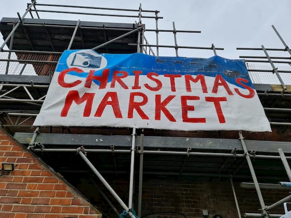 Huge Christmas Market ign up on the scaffolding
