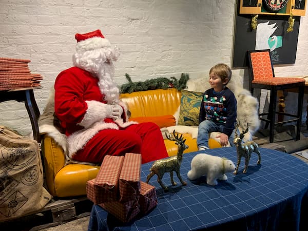 Santa with a wee boy in the grotto