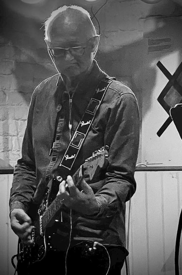 Guitarist iof The Jam Factory, close up in balck and white