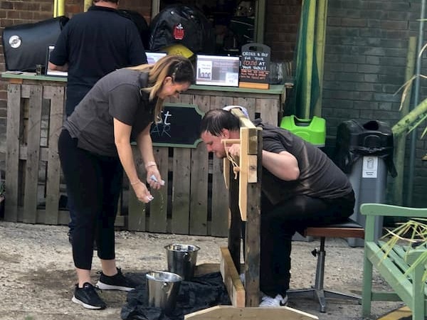 A very wet Micky in the stocks