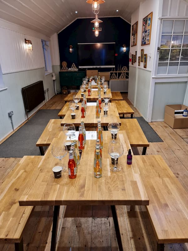 The School room laid out with glasses, FeverTree and notes for the attendees
